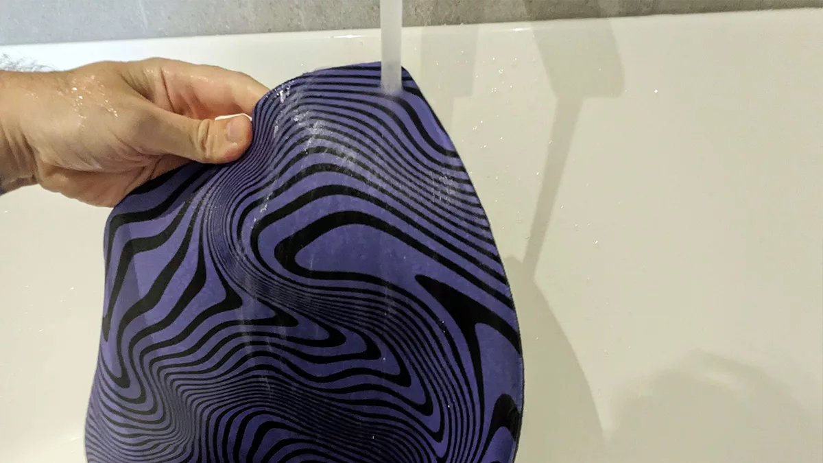 How to clean a Desk Mat in bath under tap